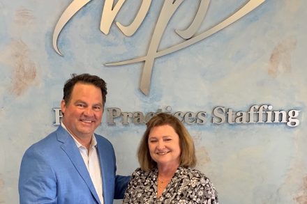 PeopleShare co-founder Dave Donald and Best Practices Staffing owner Betty Myers shake hands to seal the deal on the acquisition