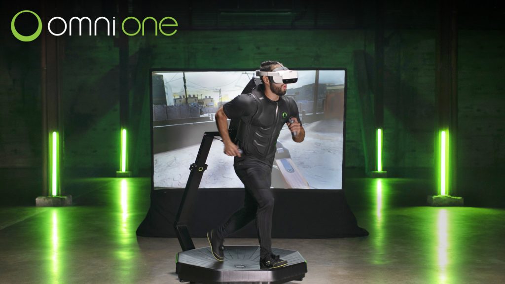 A players walking on the Omni One virtual reality treadmill